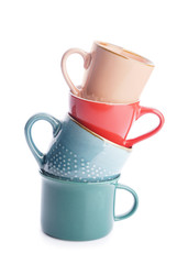 Colorful empty cups on white background