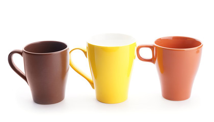 Colorful empty cups on white background