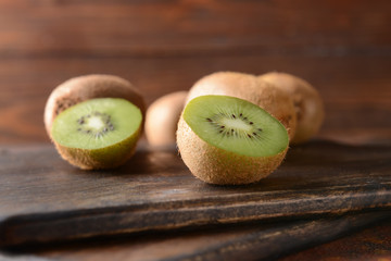 Tasty ripe kiwi on cutting board