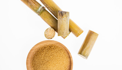 wooden dish with brown sugar on white background