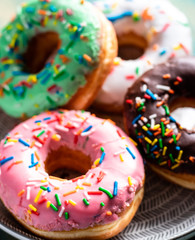 Front view of a group of sweet donuts, close up