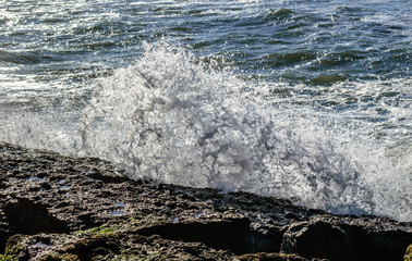 Wave breaking on rock with splashes, Portuguese coast