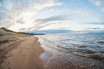 unfocused beach with sunset sky and sun