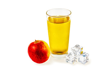 Close-up on a white background, a glass with apple juice, ice cubes and an apple