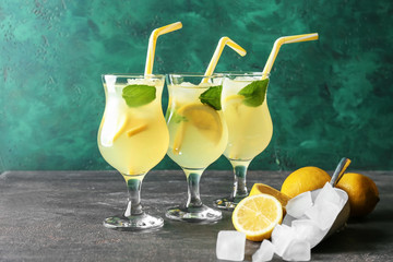 Glasses of fresh lemonade on table