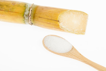 wooden spoon with white sugar, on white background
