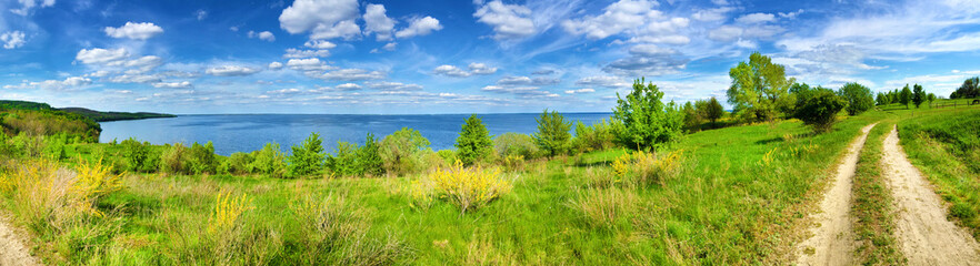 Fototapeta na wymiar Beautiful panorama of Kaniv Reservoir shore, Ukraine, in sunny day with bright cloudy sky