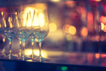 Nightlife: Wine glasses and colourful lights in a night club