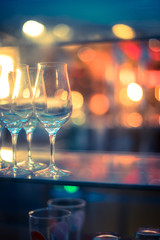 Nightlife: Wine glasses and colourful lights in a night club