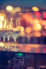 Nightlife: Wine glasses and colourful lights in a night club