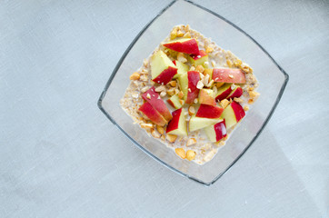 healthy breakfast - oatmeal with apples and nuts