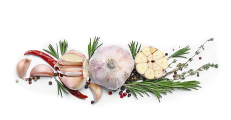 Fresh garlic, herbs and spices on white background © Pixel-Shot