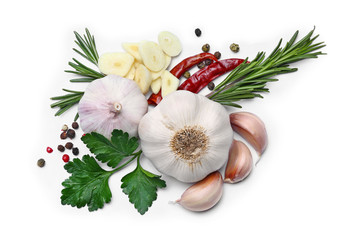Fresh garlic, herbs and spices on white background