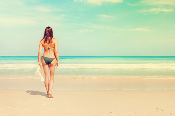 Young attractive woman on the beach