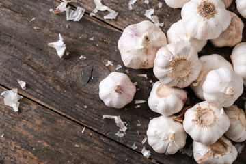 Fresh garlic on wooden background
