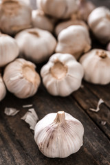 Fresh garlic on wooden background