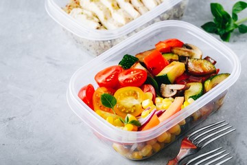 Vegan meal prep lunch box container with grilled and fresh vegetables