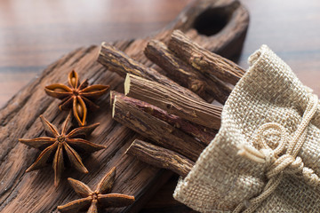 licorice root and anise on the table - Glycyrrhiza glabra