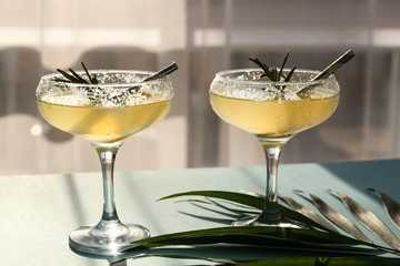 Glasses of fresh lemonade on table