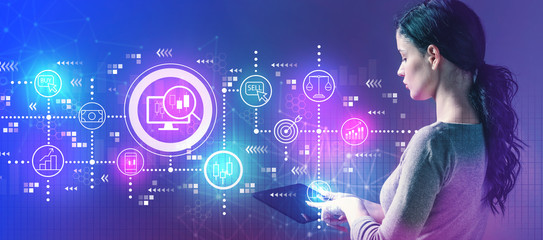 Stock trading concept with business woman using a tablet computer