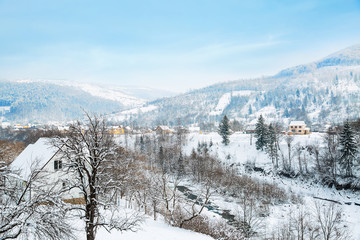 Fototapeta na wymiar Beautiful snowy mountain resort on winter day
