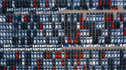 New car lined up in the port for business car import and export logistic, Aerial view.
