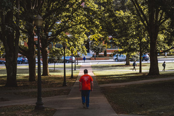 Fototapeta na wymiar Student Walking on Clemson University's campus