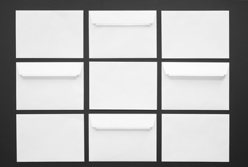 Many blank envelopes on dark background
