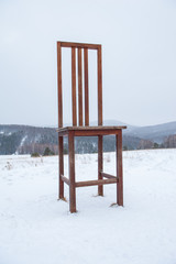 Big wooden chair in Altai mountains in winter