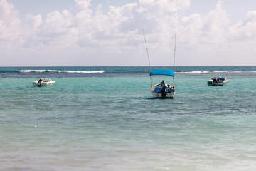 Scuba diving and fishing boats in the turquoise Caribbean Mexico