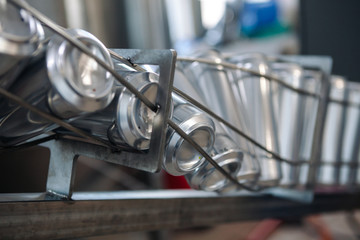 Conveyor for bottling beer in aluminum cans. Close up