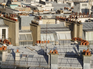 Above the rooftops of Paris, detail view with the many chimneys typical of Paris.