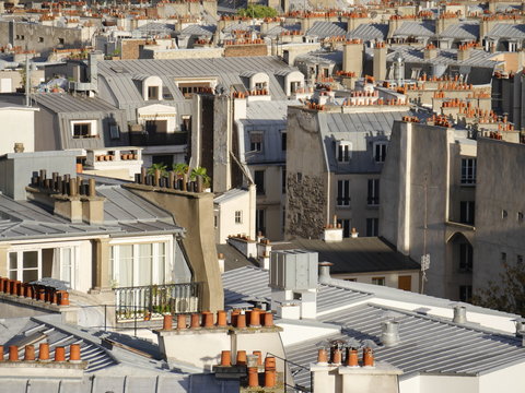 Above the rooftops of Paris, detail view with the many red chimneys typical of Paris.