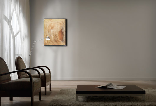 Ambiente con poltrone, tavolino e quadro
