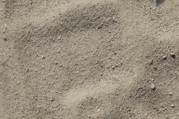 A closeup of fine sand on a flat surface