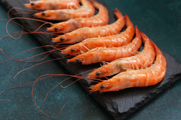 Close up of Fresh shrimps on blue concrete background