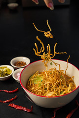 Egg Noodle sprinkling  in Chicken Curry (Khao Soi Kai)