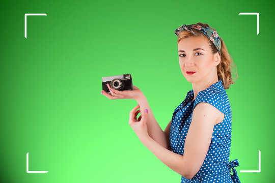 Vintage woman holding a camera in her hand