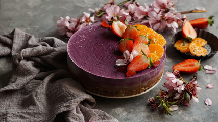 vegan raw cake, gluten free, eggs, with blueberry, cashew cream, coconut butter and coconut milk,  base made of almonds