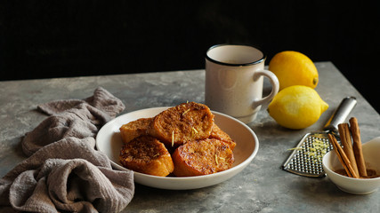 Traditional homemade Spanish torrijas grey stone background. Top view copyspace. Easter dessert 