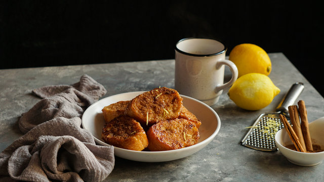 Traditional homemade Spanish torrijas grey stone background. Top view copyspace. Easter dessert 