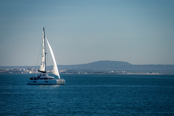 Fototapeta premium Sailing yacht boat in Lisbon. Luxury vacation.