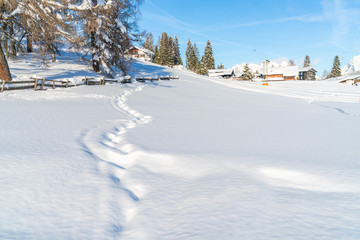 Beautiful winter landscape with snow covered houses and ski slopes n Seefeld in the Austrian state...