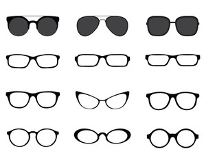 Black silhouettes of different eyeglasses on a white background