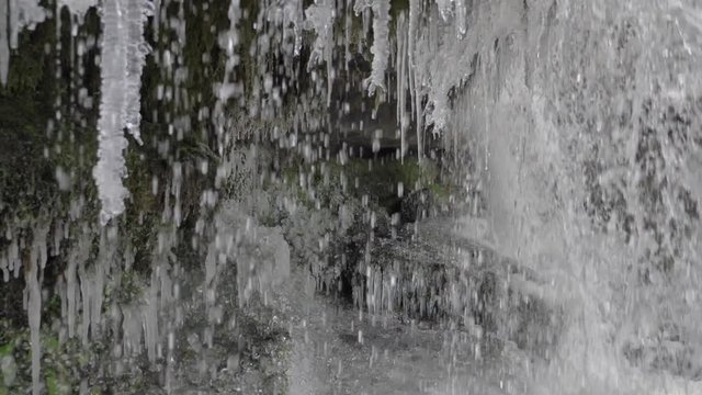 Slow motion shot of frozen waterfall.