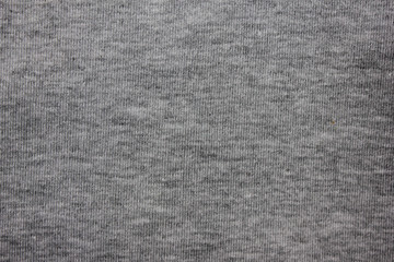 Fototapeta na wymiar Gray texture background of faded grey colored sweater. Cloth surface & fabric material design for empty backdrop, stylish fashion clothes simple pattern. Modern apparel canvas and copy space template