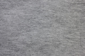 Gray texture background of faded grey colored sweater. Cloth surface & fabric material design for empty backdrop, stylish fashion clothes simple pattern. Modern apparel canvas and copy space template