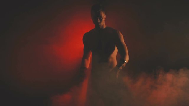 Silhouette of a dancing sexy man