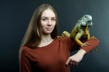 beautiful woman and green iguana 