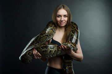 sensual girl and python in studio